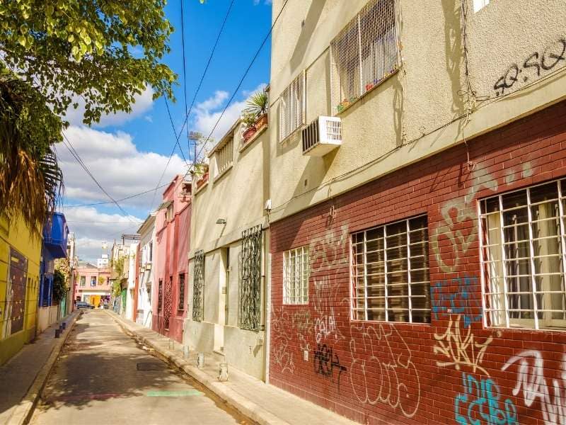 Urban alley with closely spaced buildings reviewed for boundary surveying, shared walls, and lot line clarity.